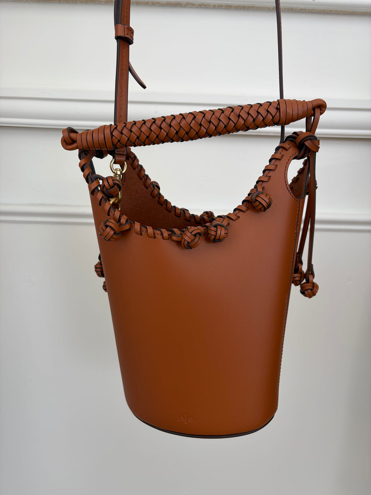 Aje Tan Leather Woven Trim Bucket Bag