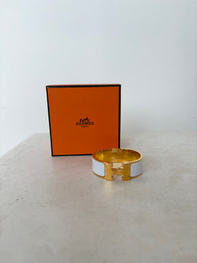 Hermès Gold Tone and White Enamel Clic Clac H Bracelet`