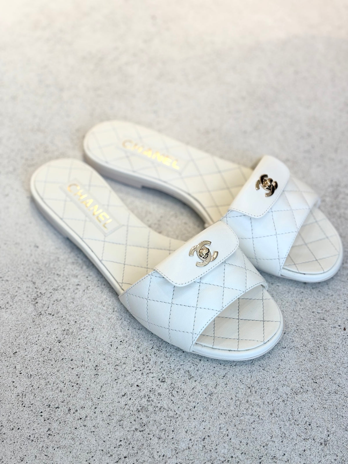 Chanel White Quilted Leather Turnlock Slides, 37.5