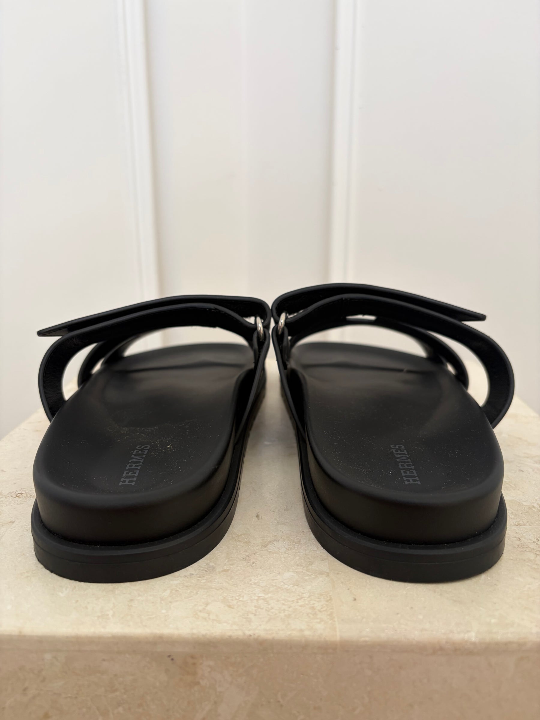 Hermès Black Leather Chypre Sandals, 38.5