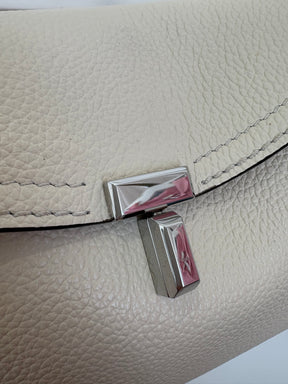 Totême T-Lock Textured Leather Clutch Cream