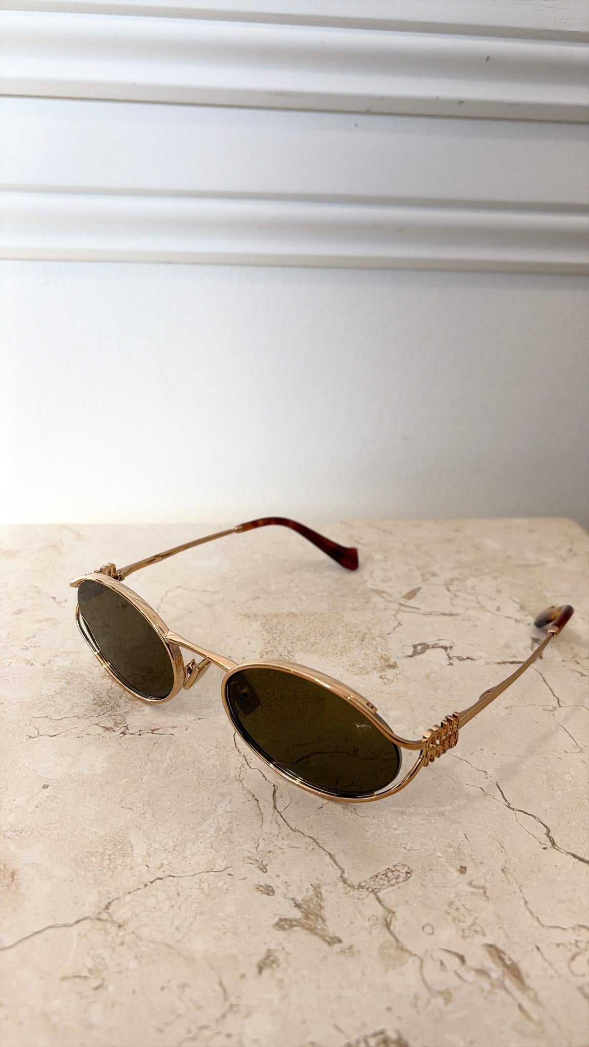 Miu Miu Logo Oval Sunglasses Gold