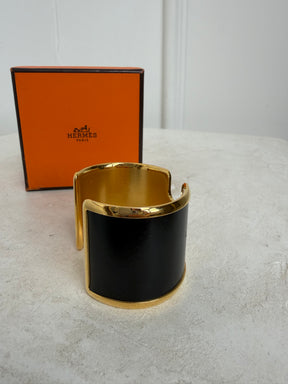 Hermès Black and Gold Leather Olympe cuff bracelet
