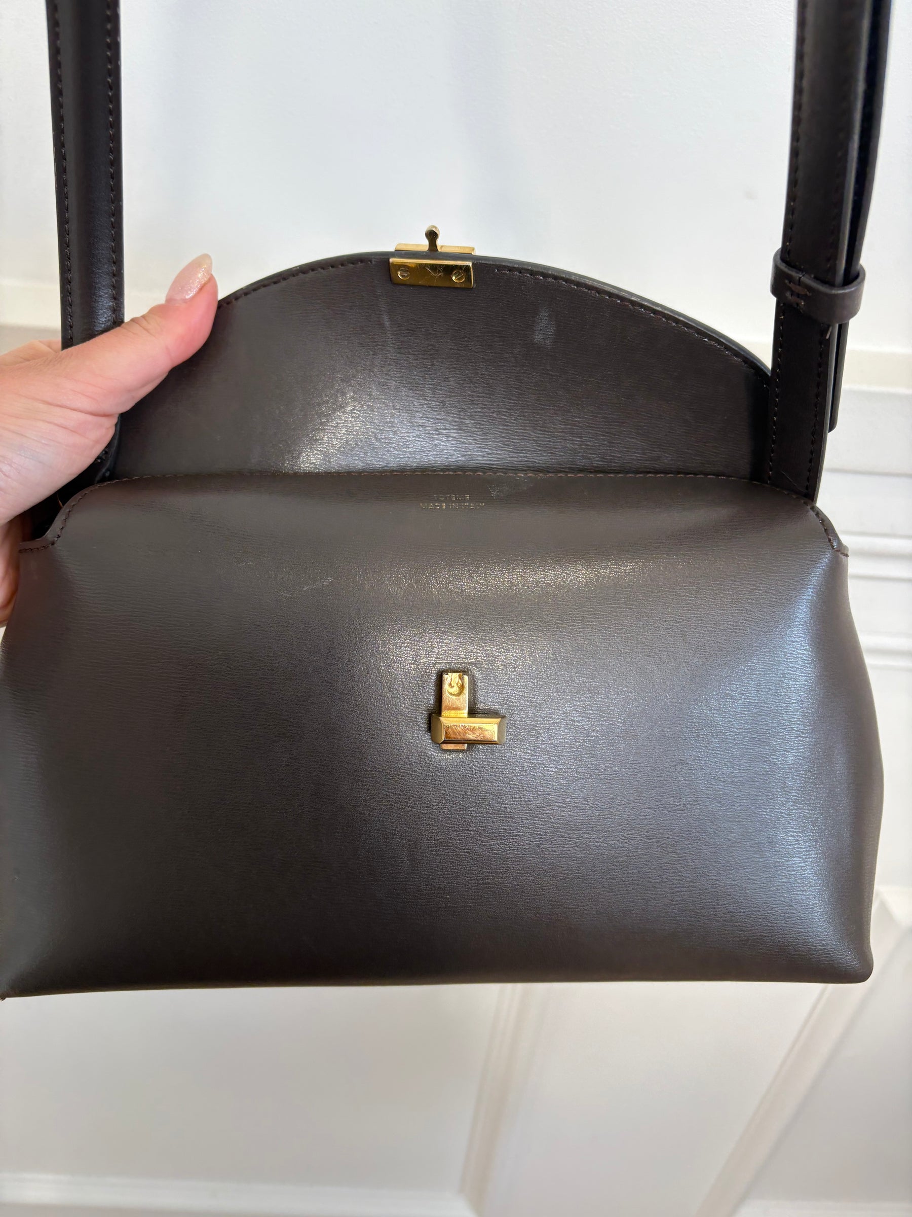 Totême Brown T-Lock Small leather clutch