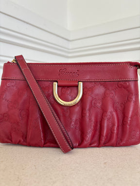 Gucci Red Monogram Embossed leather Wristlet Pouch