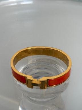 Hermès Orange and Gold Clic H Bracelet