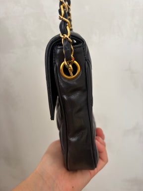 Chanel Black Lambskin Leather Vertical Mini Flap bag