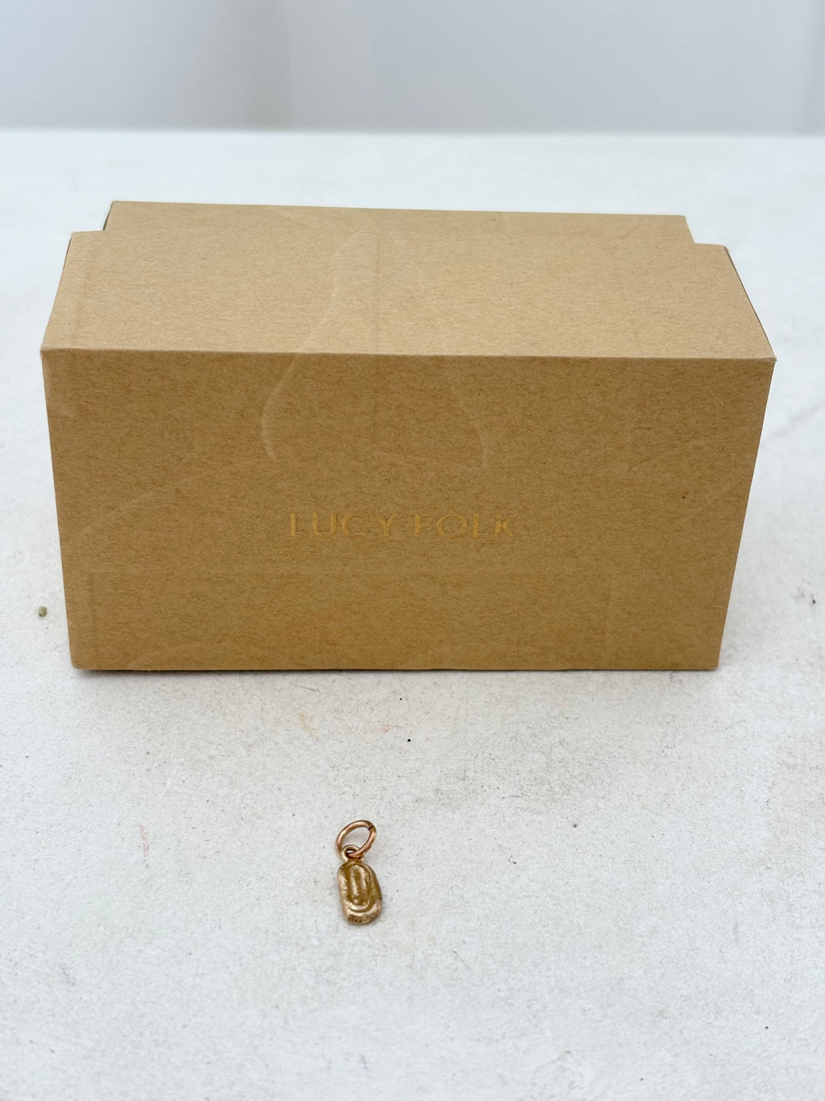 Lucy Folk 9k Gold Draa Charm