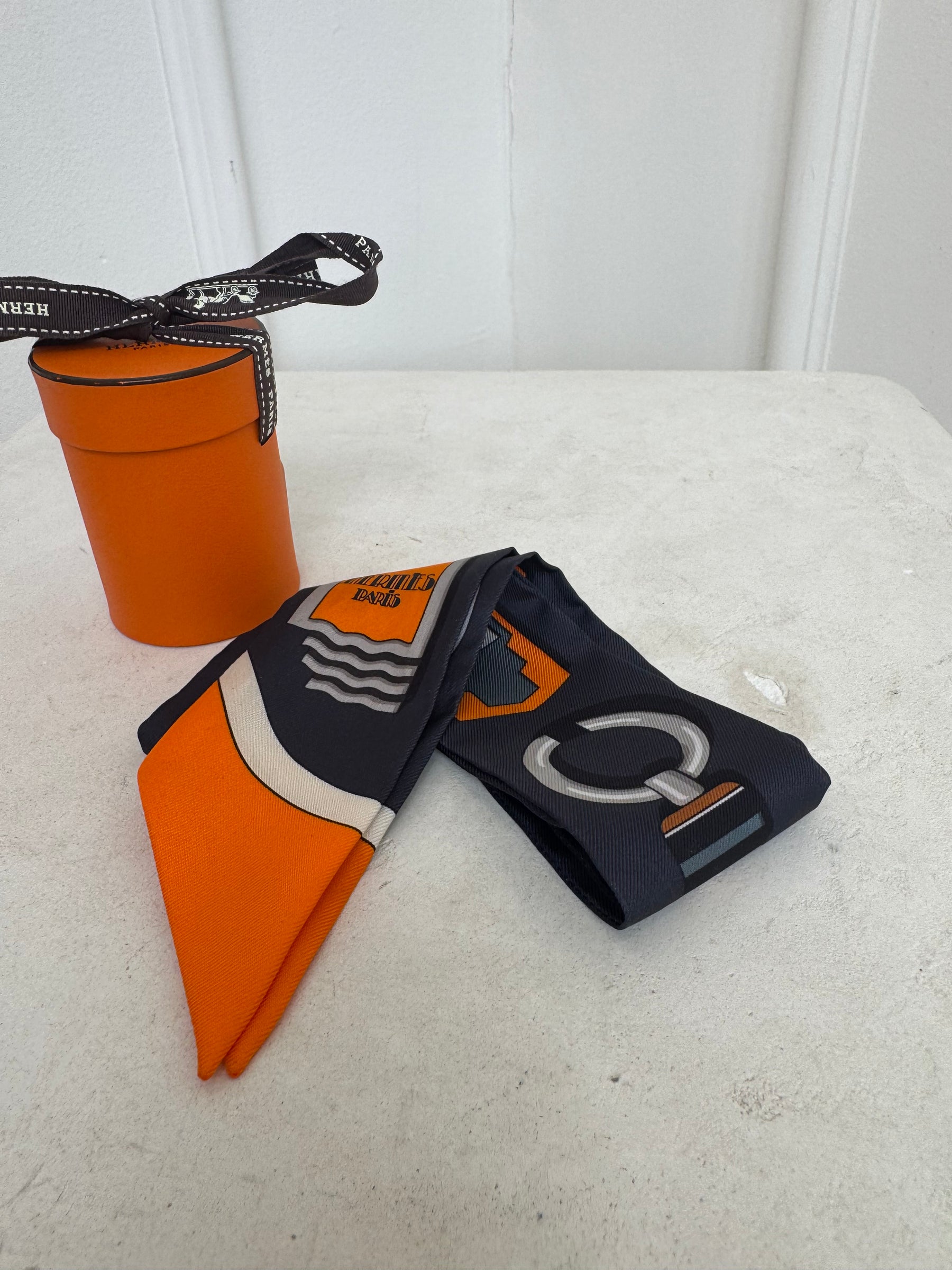 Hermès 100% Silk Navy And Orange Printed Twilly