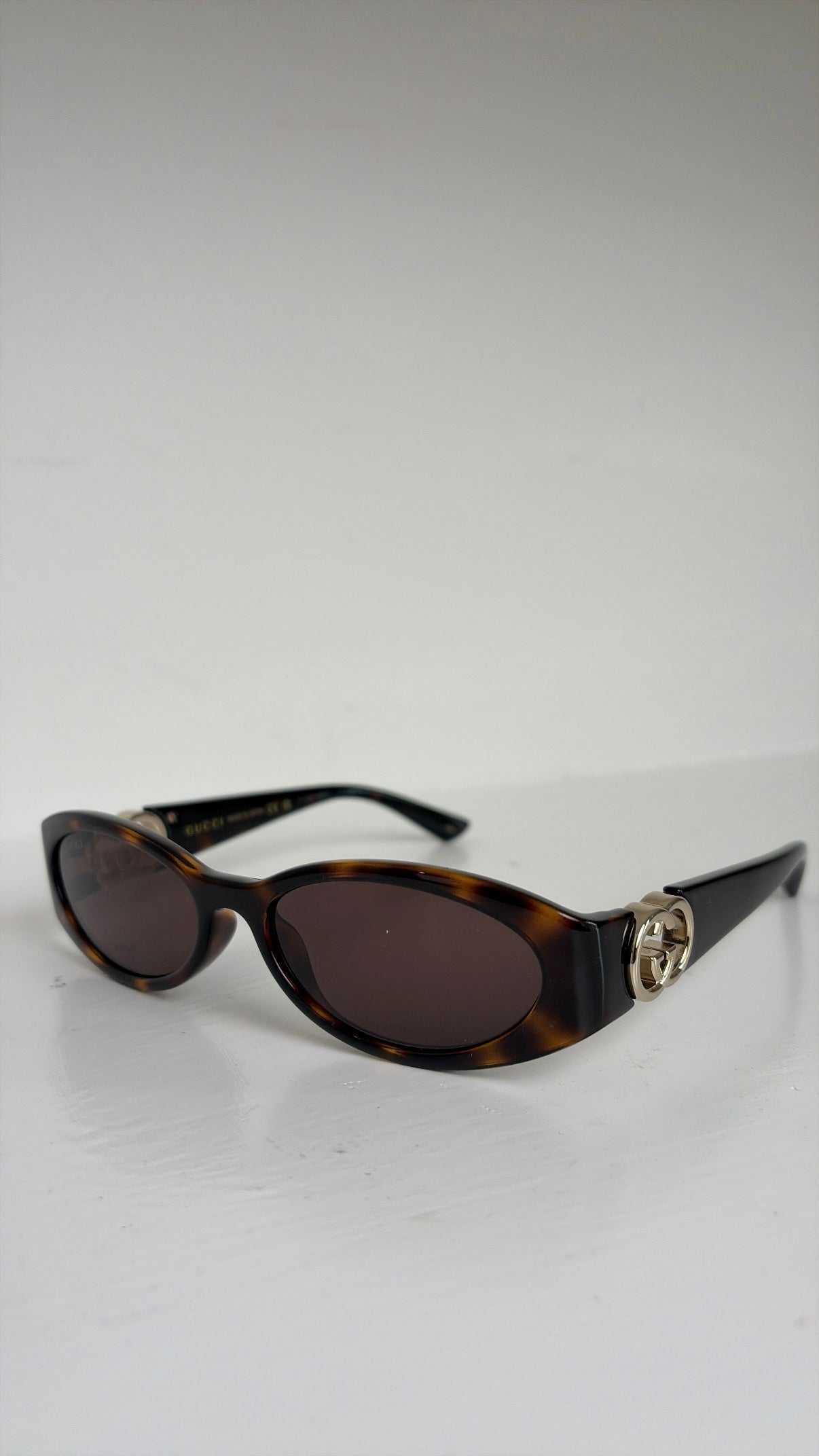Gucci Tortoiseshell Oval Logo Arm Sunglasses