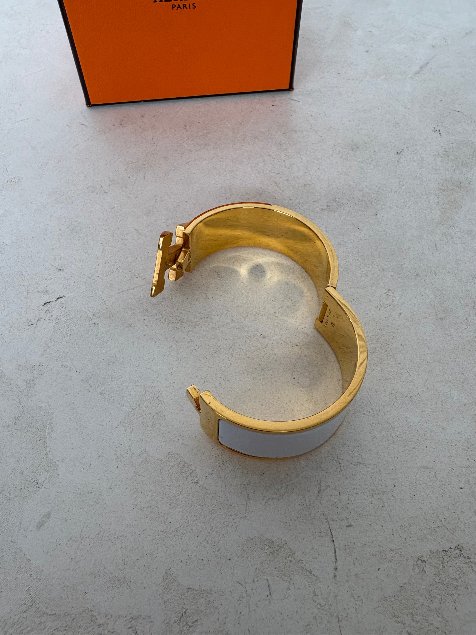 Hermès Gold Tone and White Enamel Clic Clac H Bracelet`