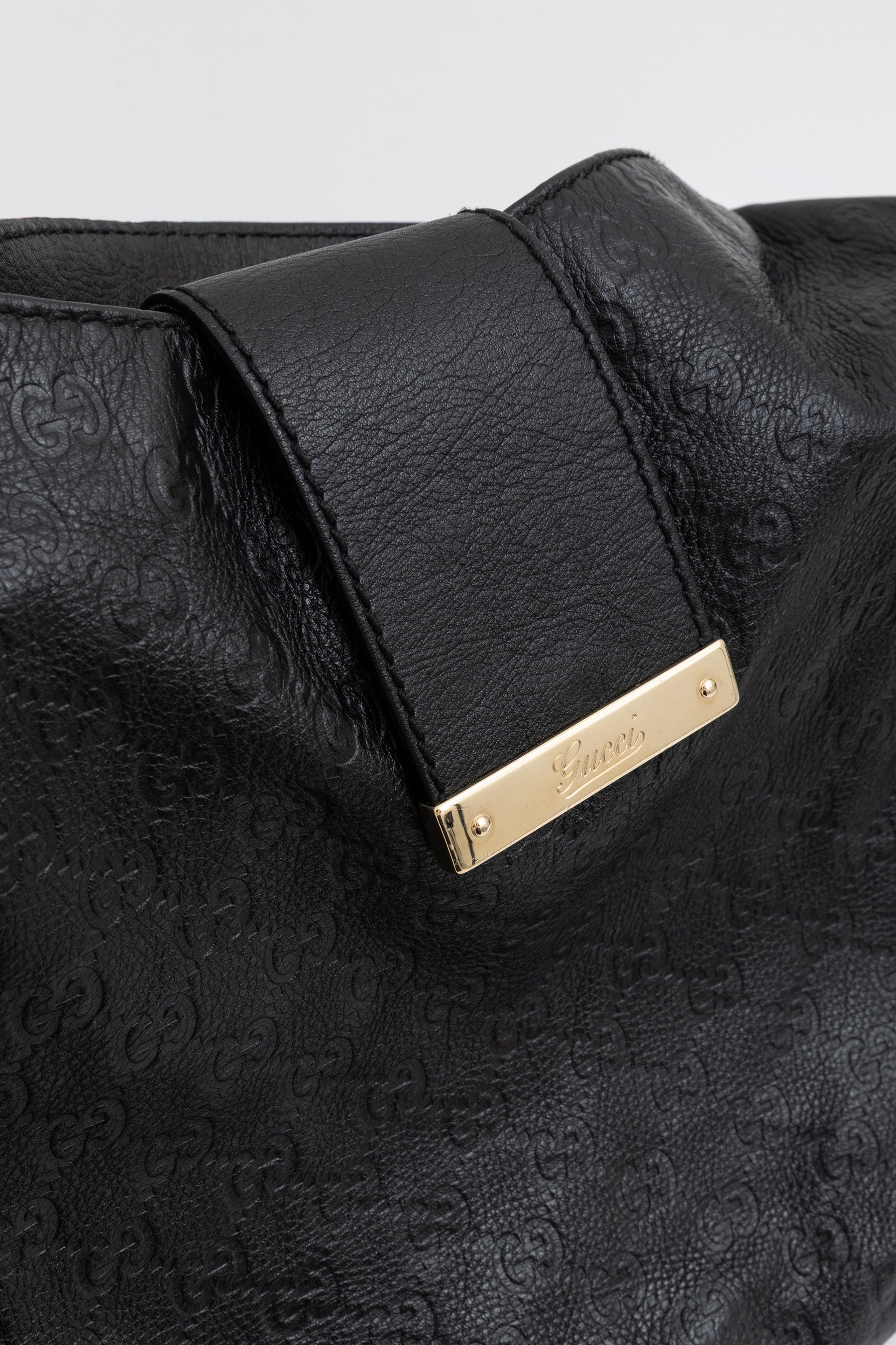 Embossed Monogram Hobo Bag