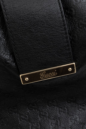 Embossed Monogram Hobo Bag