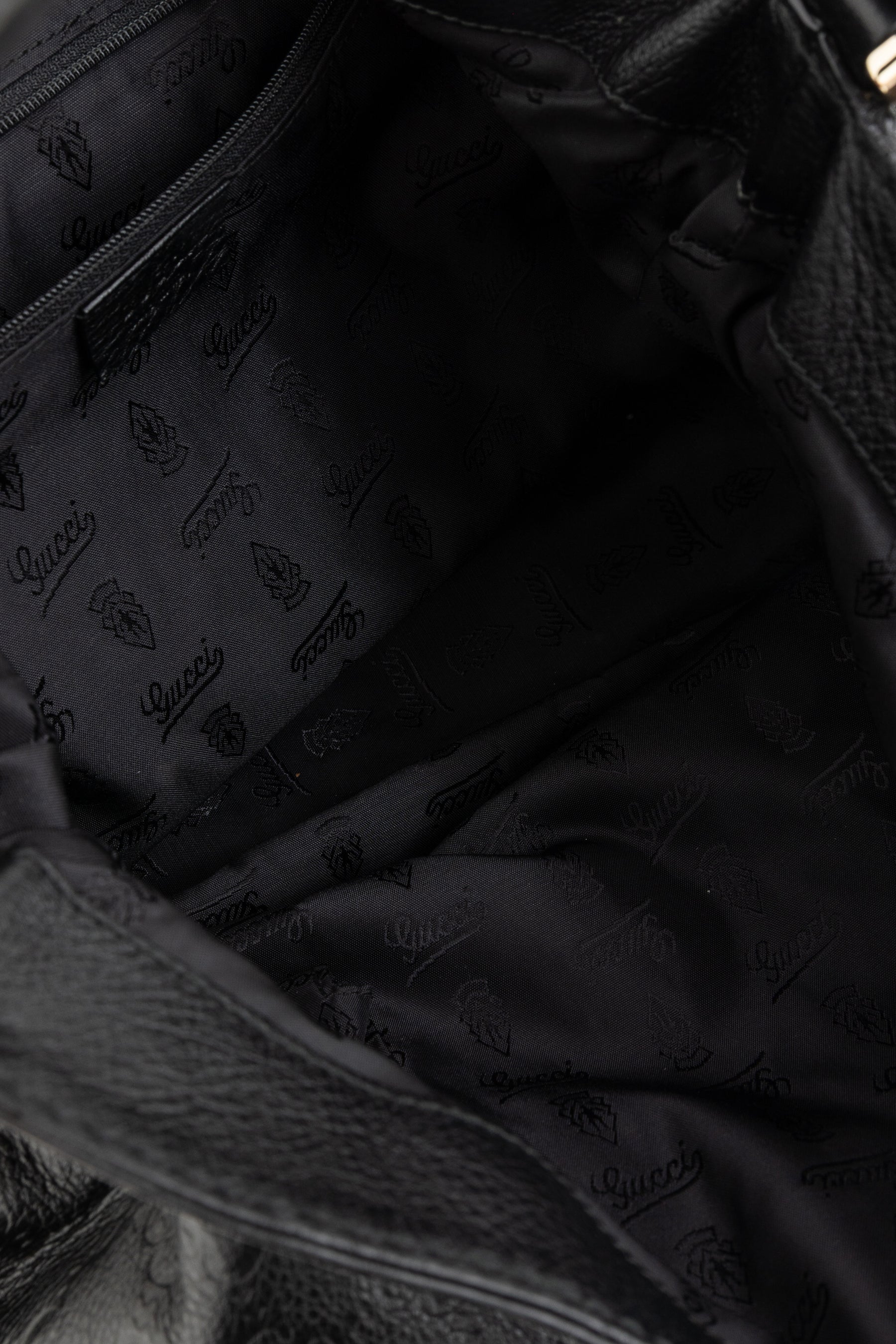 Embossed Monogram Hobo Bag