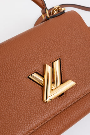Twist One Handle PM Handbag
