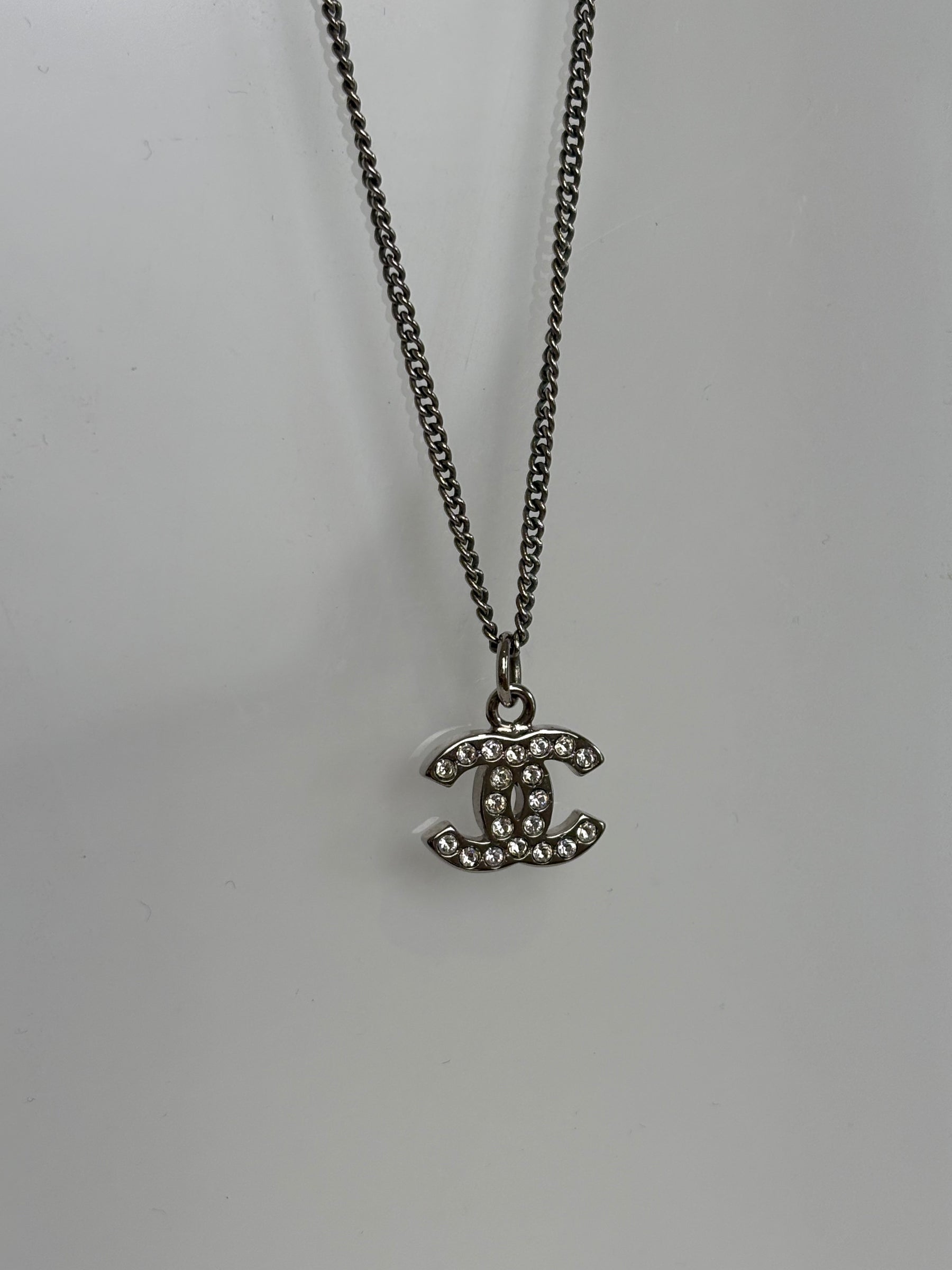Chanel Silver and Crystal Logo Pendant Necklace