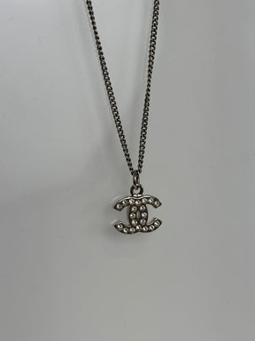 Chanel Silver and Crystal Logo Pendant Necklace