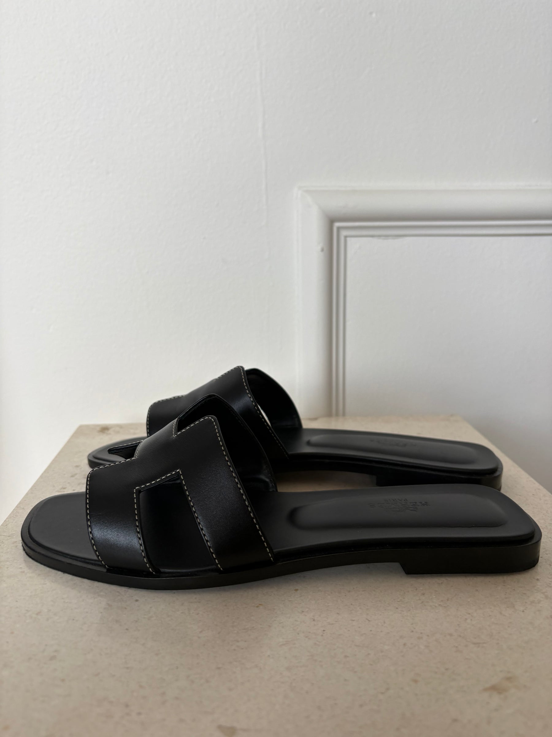 Hermès Black Leather Oran Sandals, 38