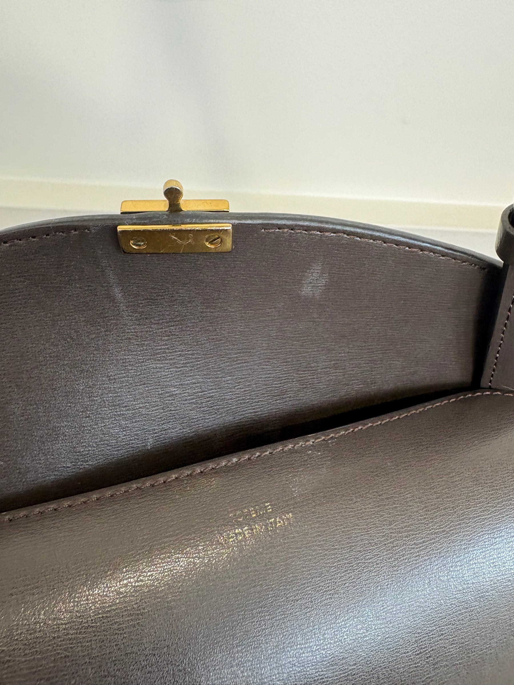 Totême Brown T-Lock Small leather clutch
