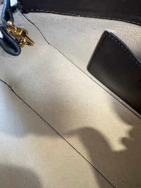 Totême Brown T-Lock Small leather clutch