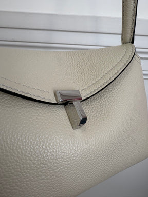 Totême T-Lock Textured Leather Clutch Cream