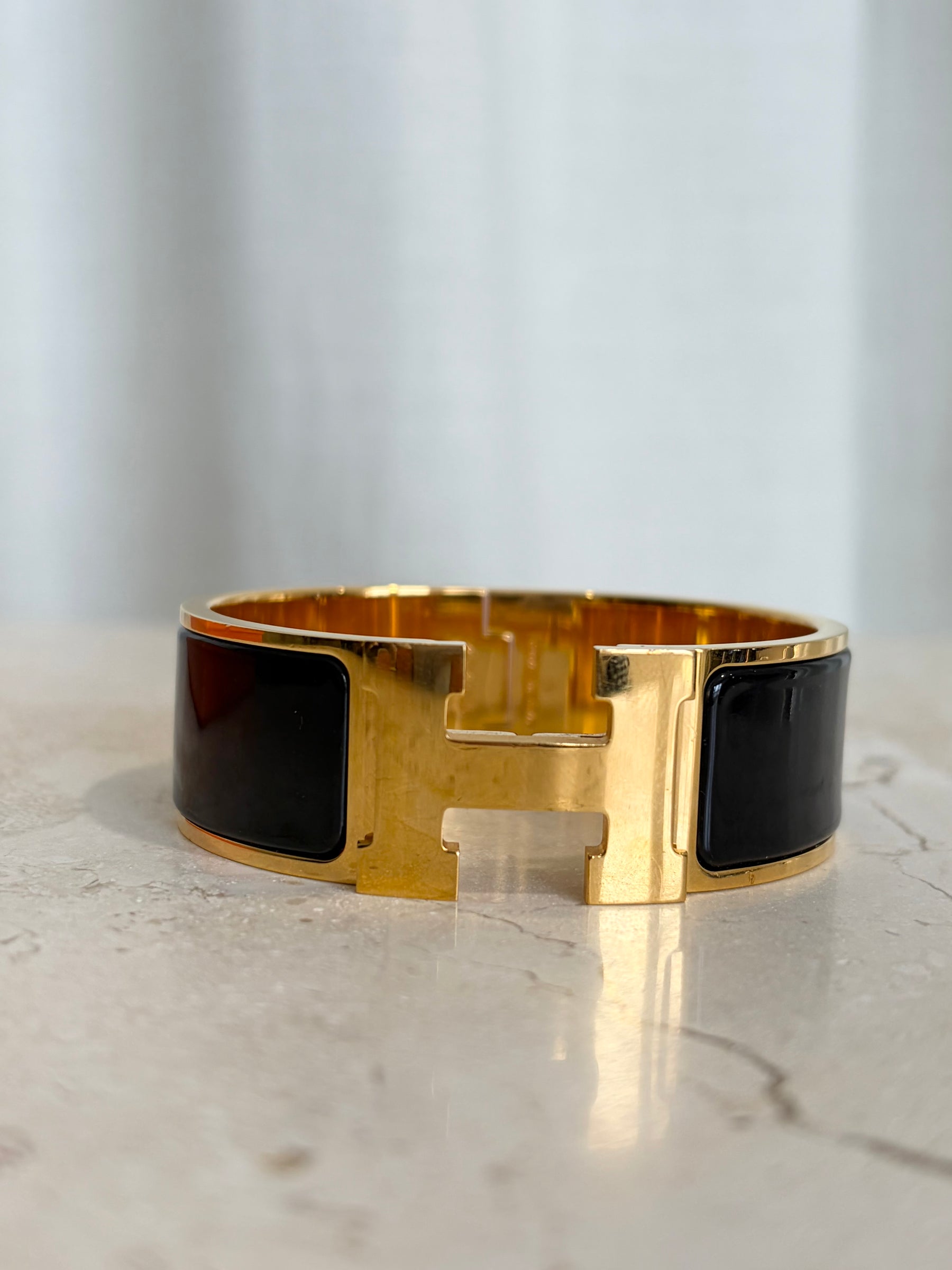 Hermès Clic H Wide Black With Yellow Gold, PM