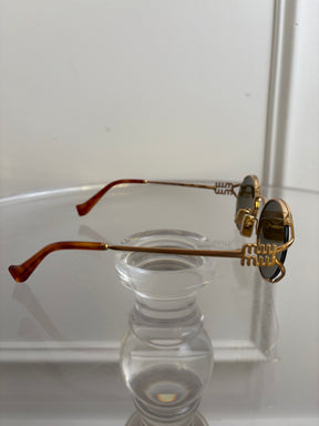 Miu Miu Gold Oval Logo Sunglasses