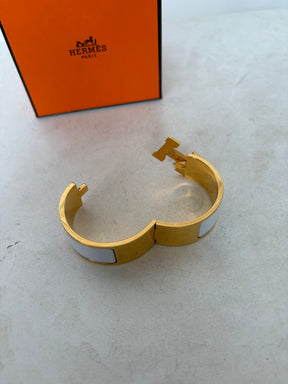 Hermès Gold Tone and White Enamel Clic Clac H Bracelet`