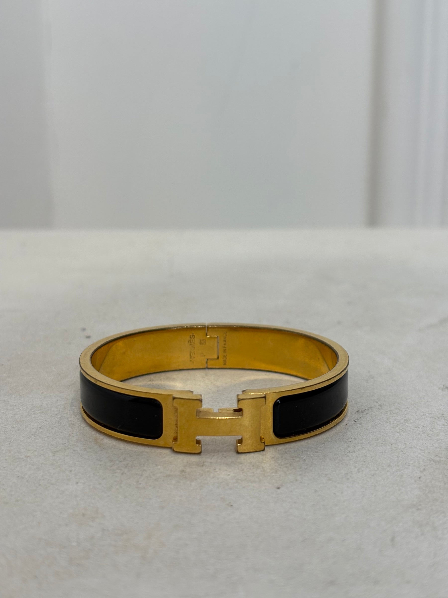 Hermès Black and Gold Clic H Bracelet