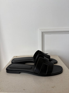 Hermès Black Leather Oran Sandals, 38
