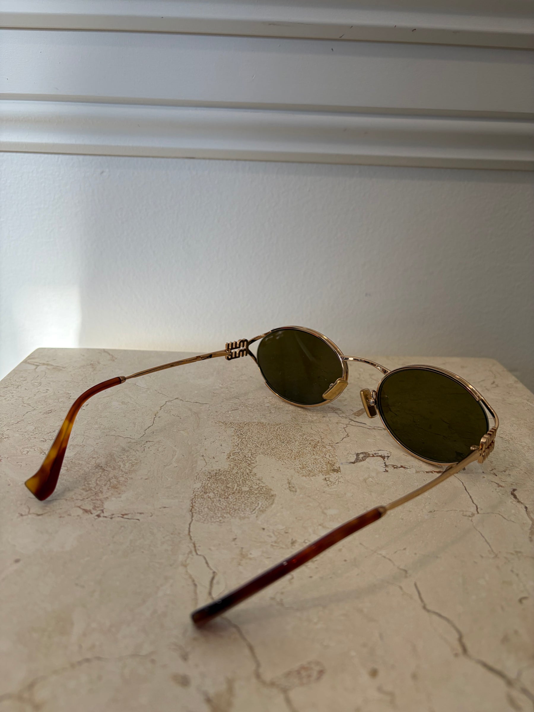 Miu Miu Logo Oval Sunglasses Gold
