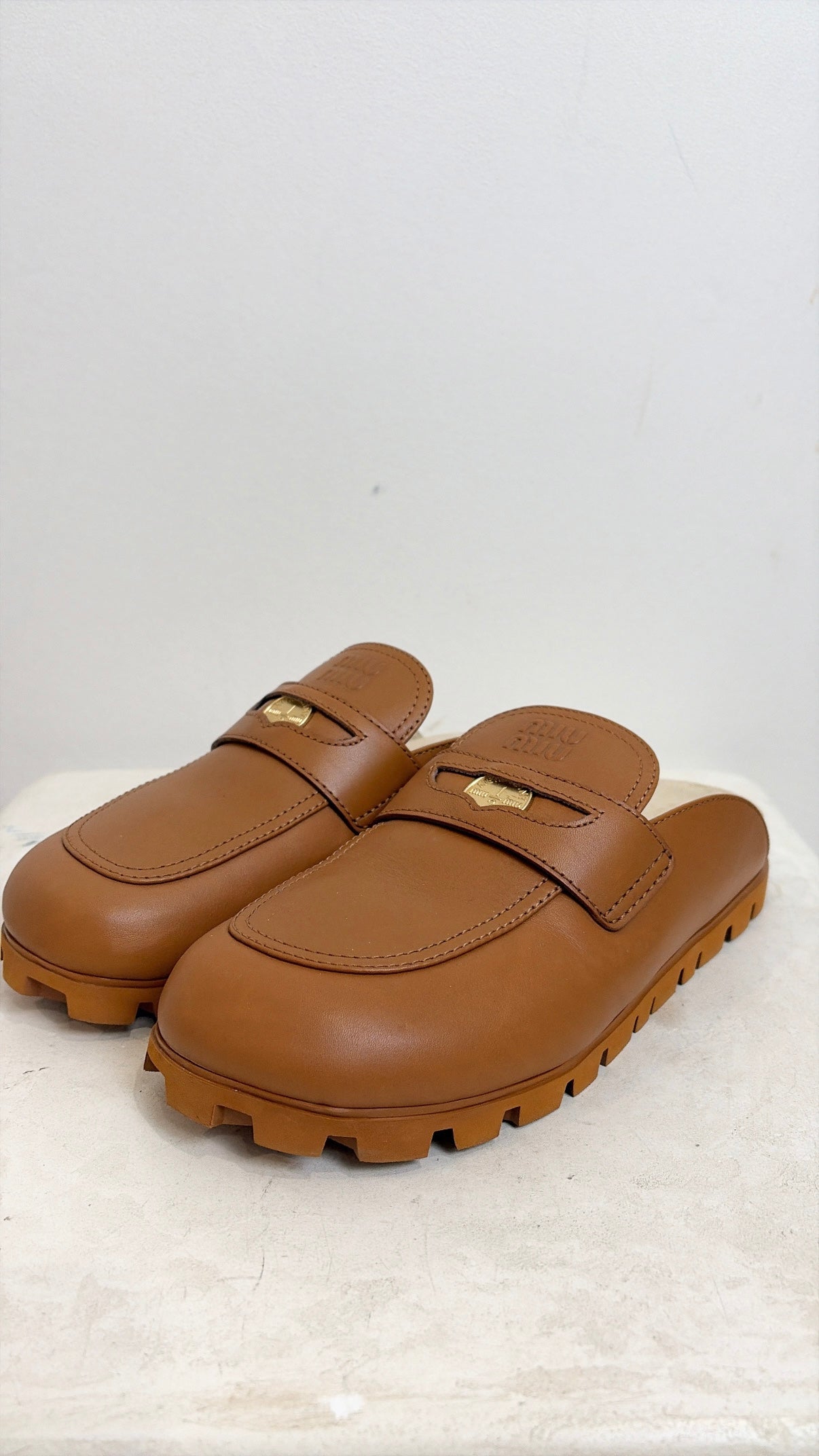 Miu Miu Logo Leather Mules In Cognac, 39.5