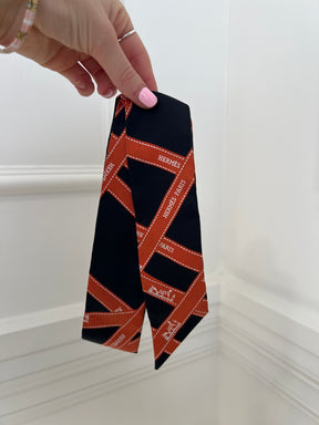 Hermès Black and Orange Ribbon Print Silk Twilly