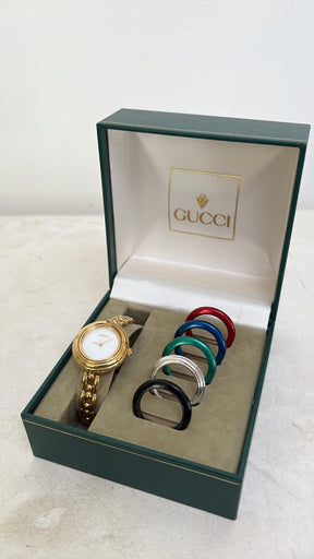 Gucci Gold Tone Interchangeable Bezel Watch