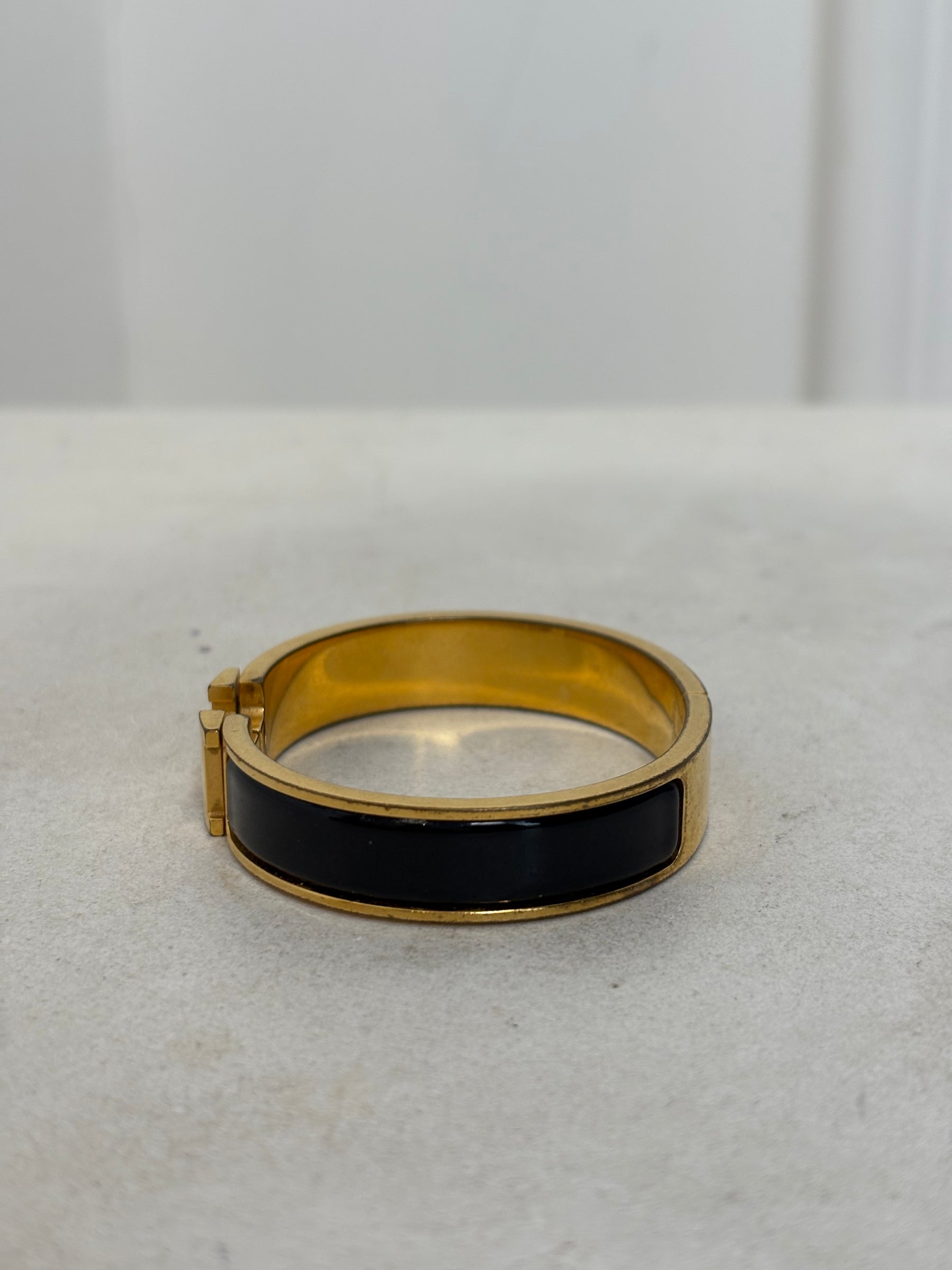 Hermès Black and Gold Clic H Bracelet