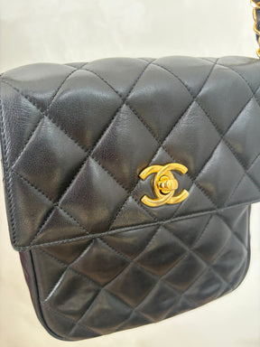 Chanel Black Lambskin Leather Vertical Mini Flap bag