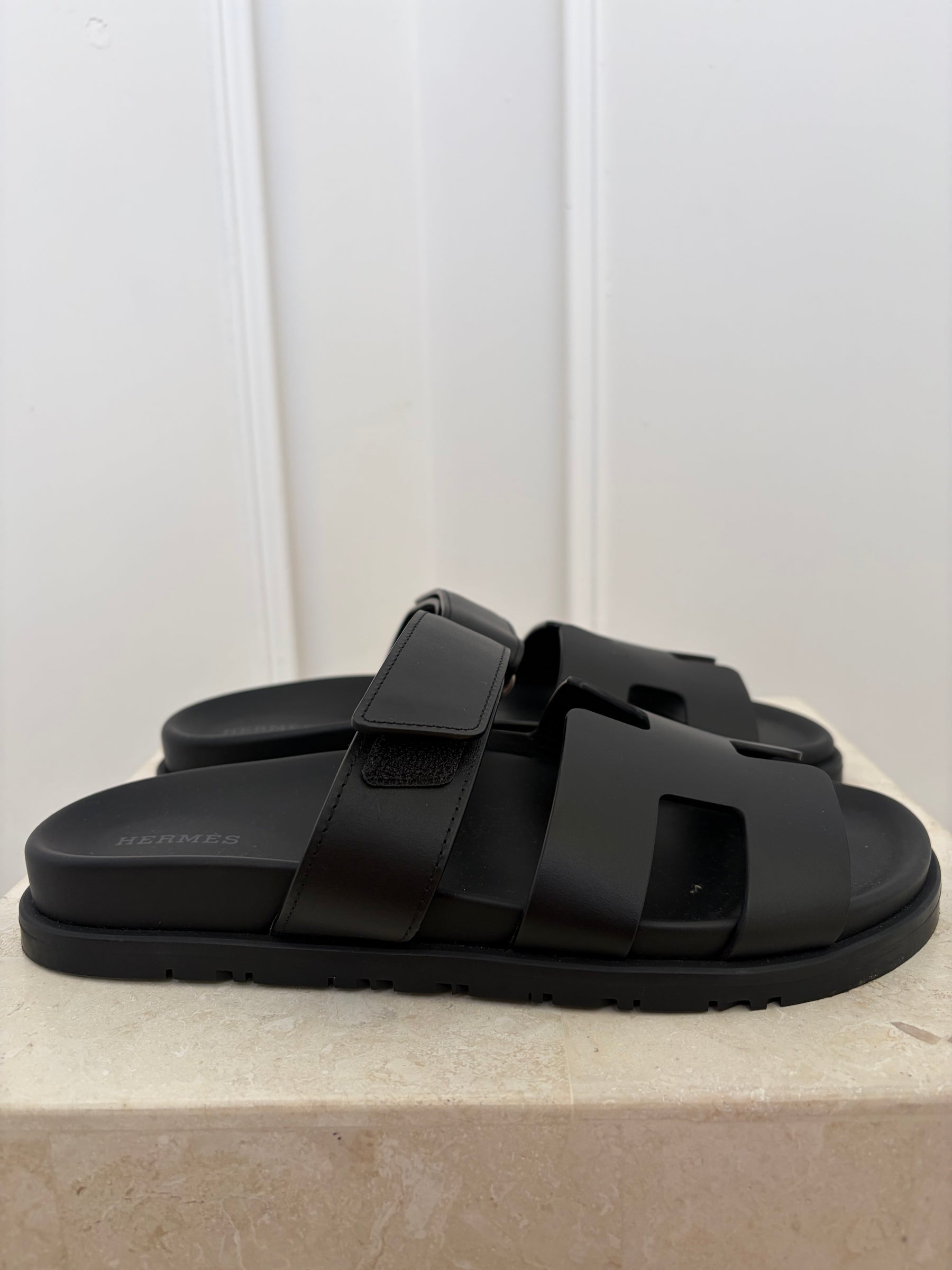 Hermès Black Leather Chypre Sandals, 38.5