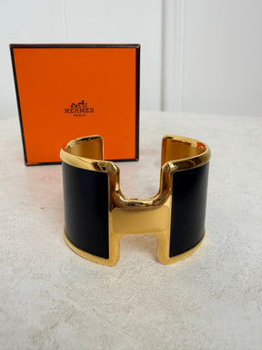 Hermès Black and Gold Leather Olympe cuff bracelet
