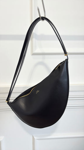 Totême Black Leather Scooped Sling Bag