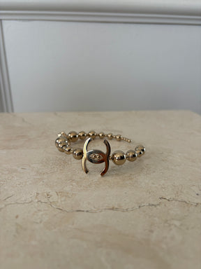 Chanel Gold Tone Ball Logo Hoops