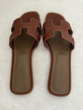 Hermès Gold Leather Oran Sandals, 41