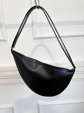 Totême Black Leather Scooped Sling Bag