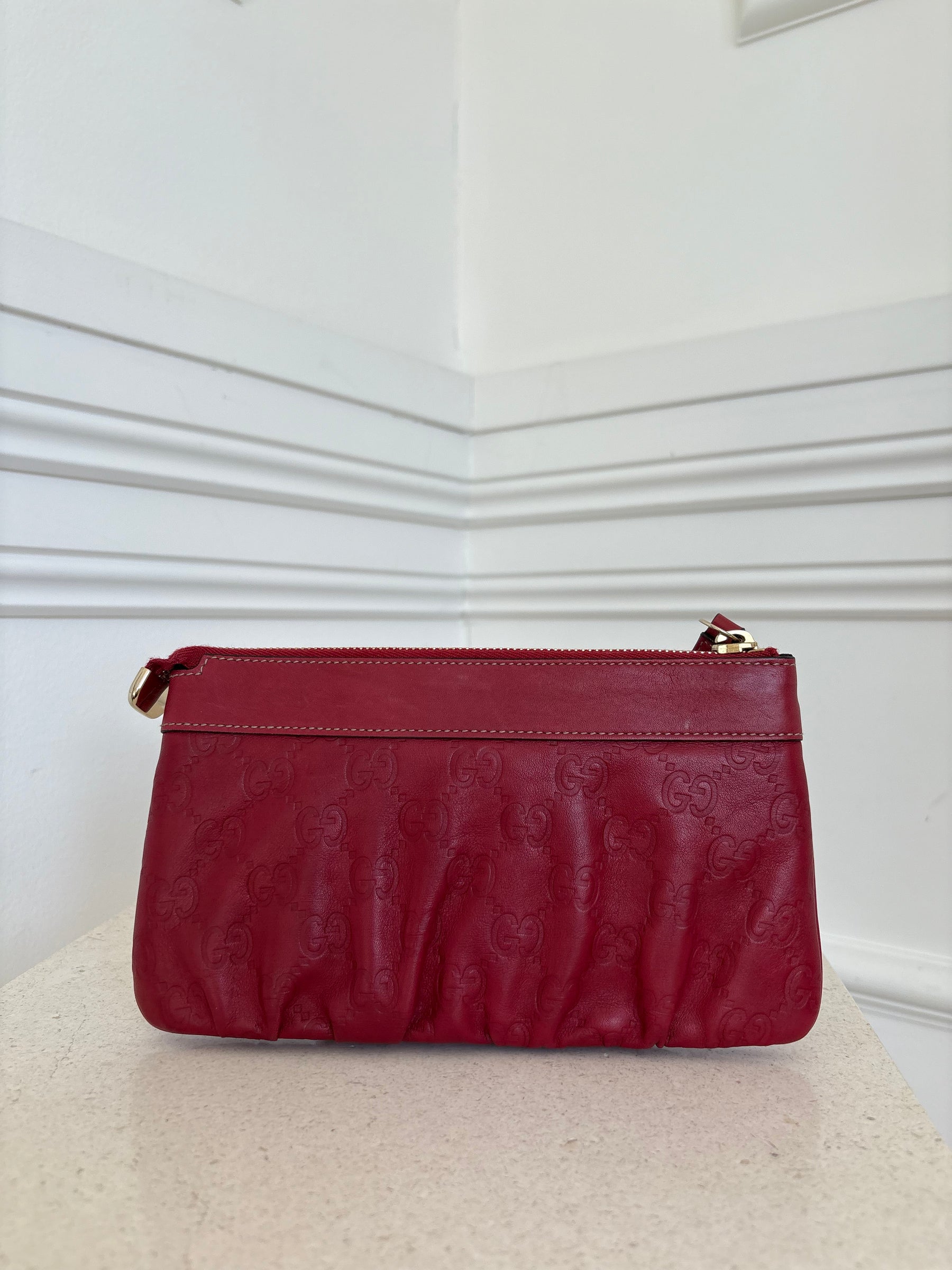 Gucci Red Monogram Embossed leather Wristlet Pouch