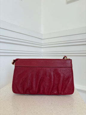 Gucci Red Monogram Embossed leather Wristlet Pouch