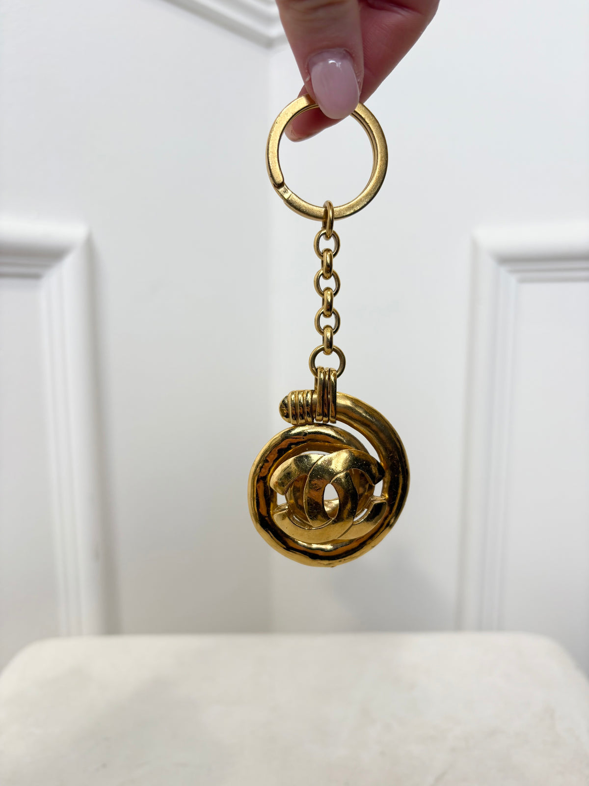Chanel Gold Tone Spiral Logo Keyring