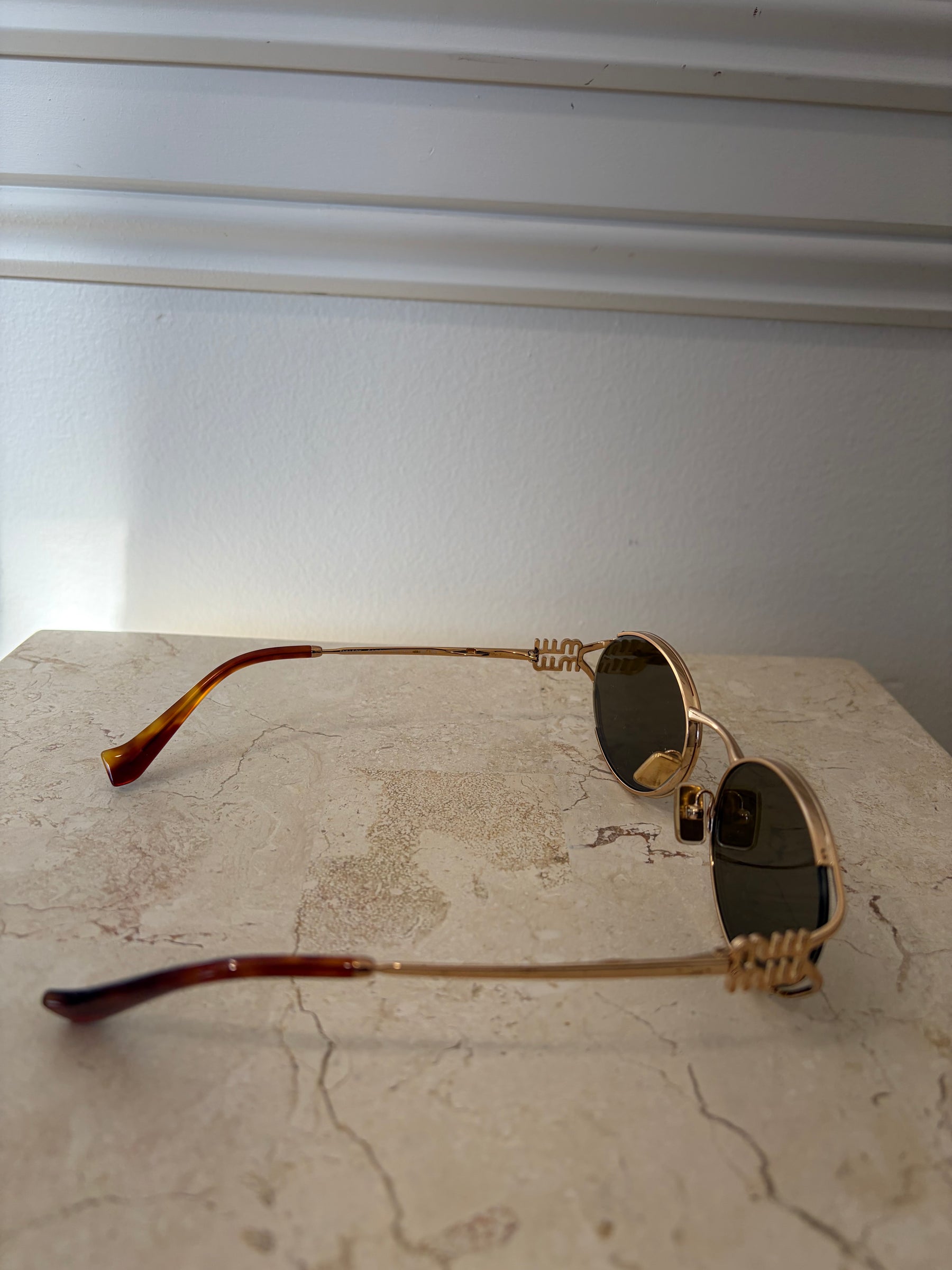 Miu Miu Logo Oval Sunglasses Gold
