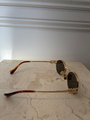 Miu Miu Logo Oval Sunglasses Gold