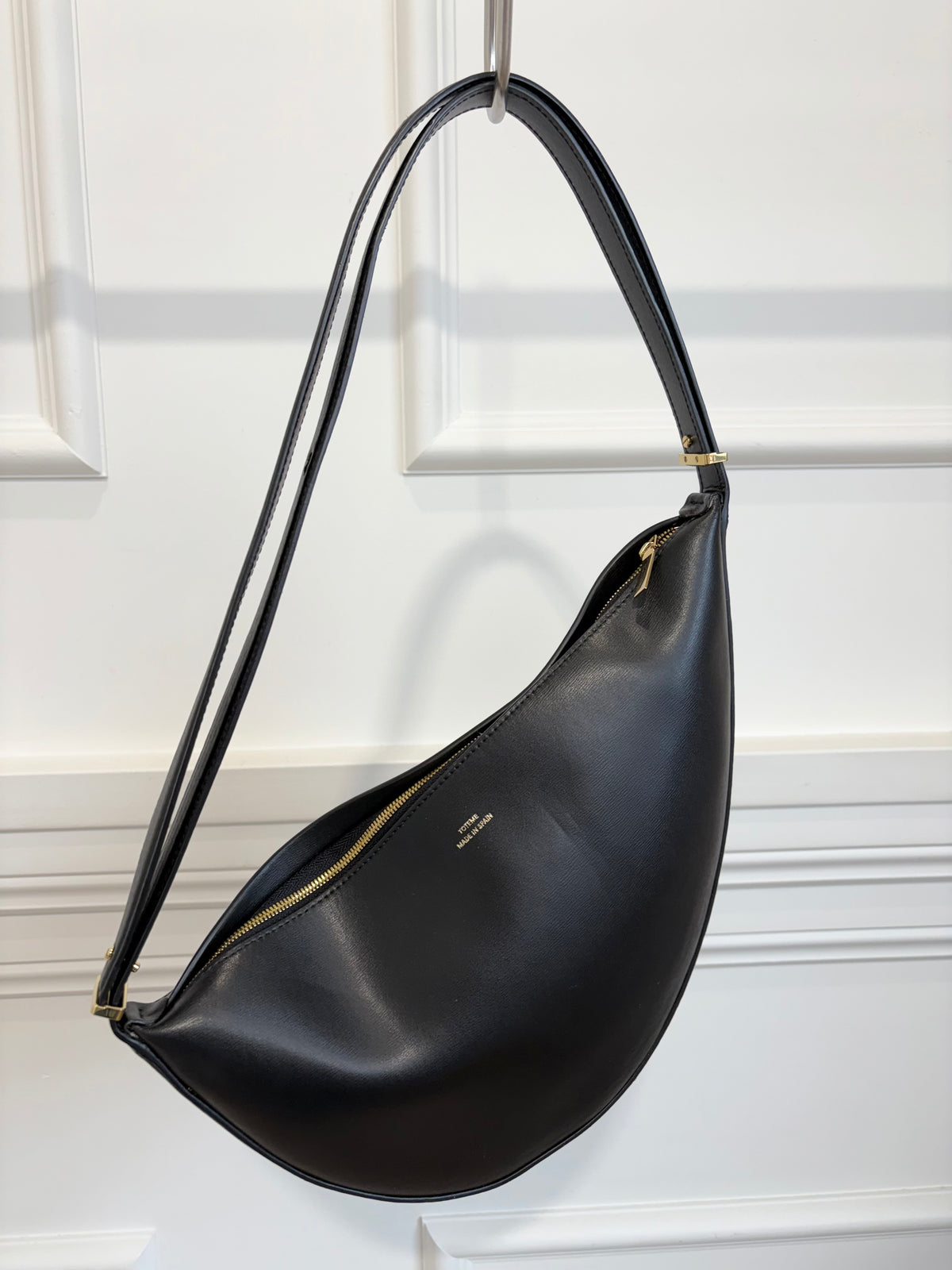 Totême Black Leather Scooped Sling Bag