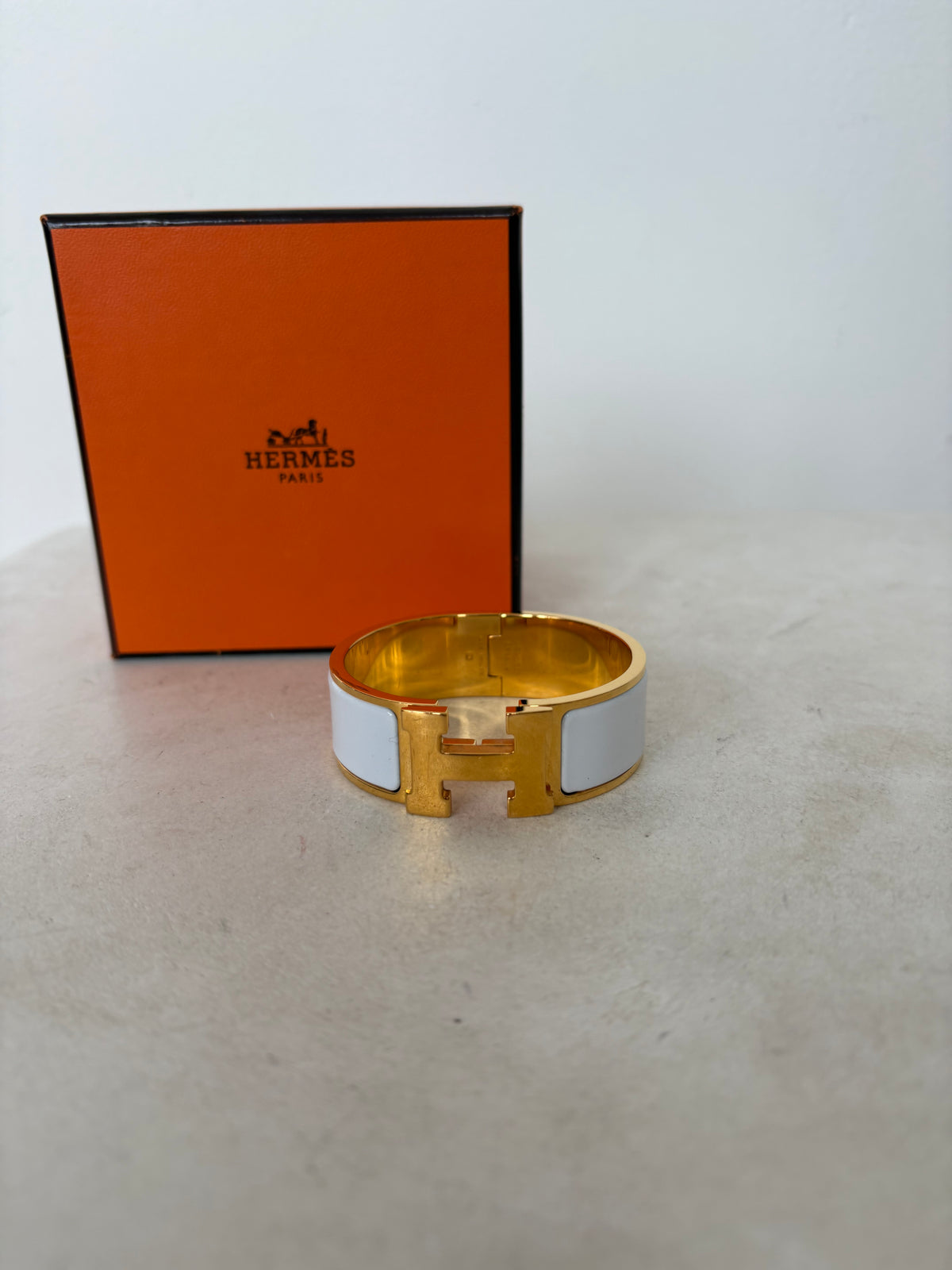 Hermès Gold Tone and White Enamel Clic Clac H Bracelet`