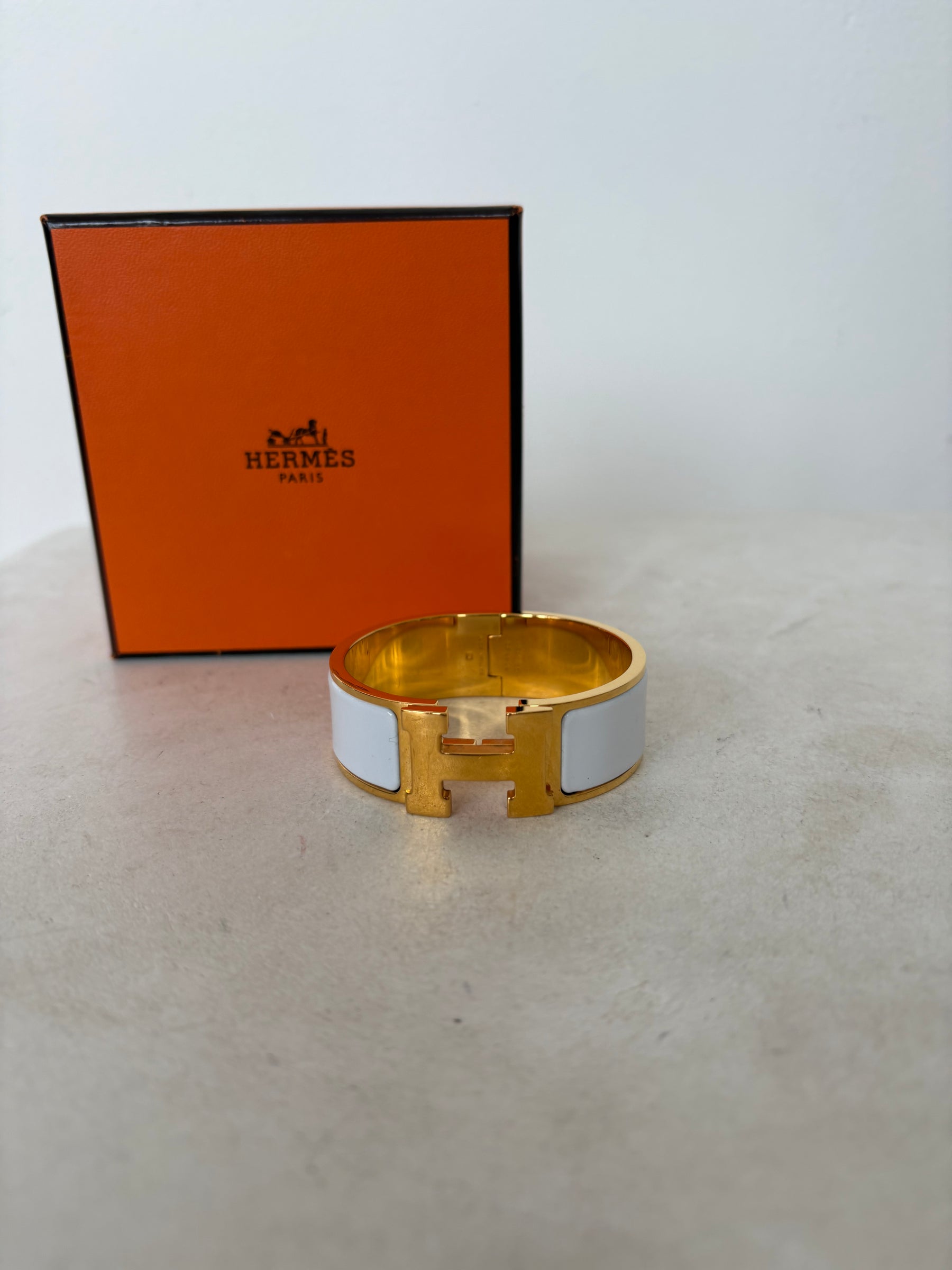 Hermès Gold Tone and White Enamel Clic Clac H Bracelet`